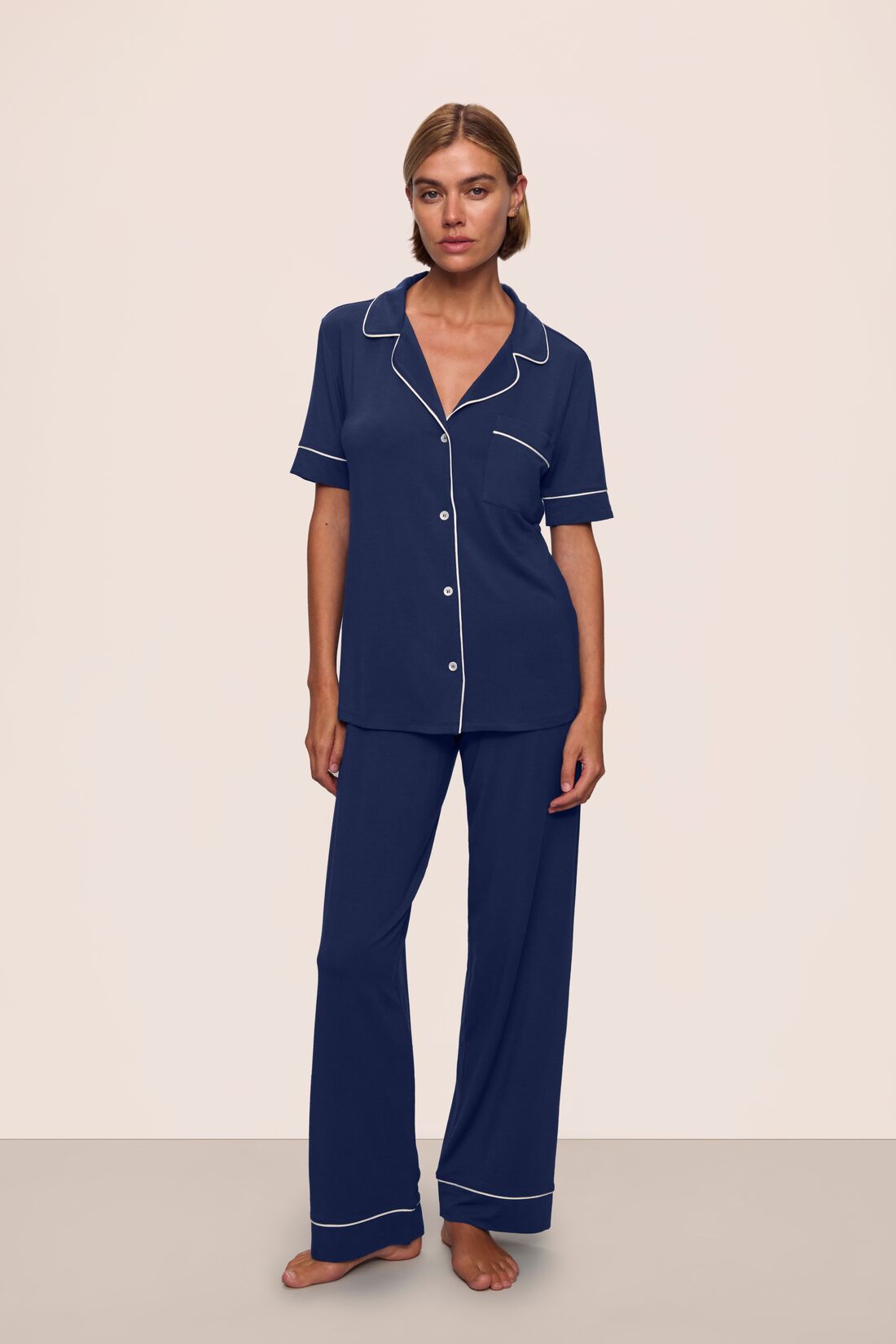 Model is wearing Gisele TENCEL™ Modal Short Sleeve & Pant PJ Set in Navy/Ivory