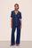 Model is wearing Gisele TENCEL™ Modal Short Sleeve & Pant PJ Set in Navy/Ivory