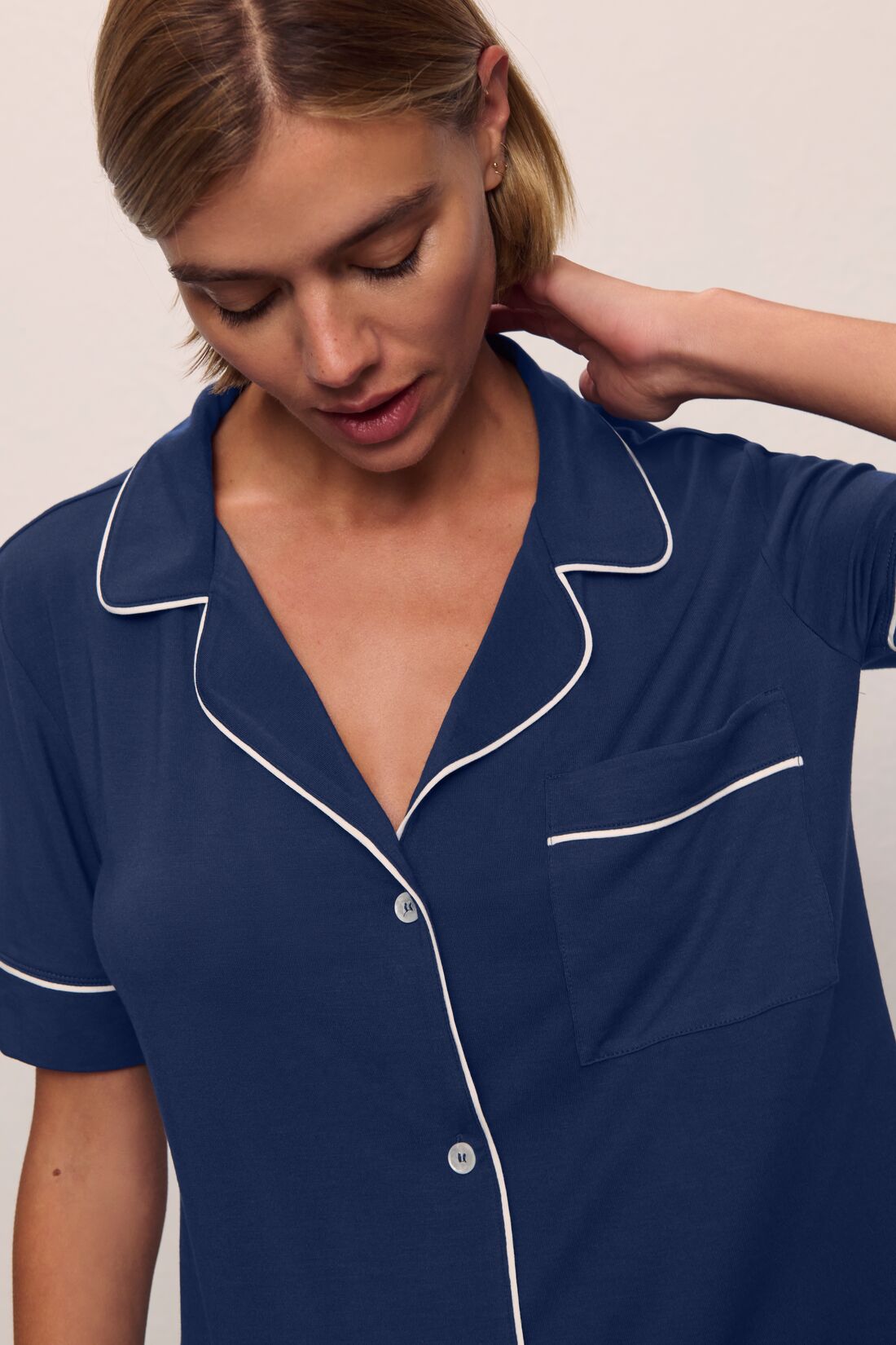 Model is wearing Gisele TENCEL™ Modal Short Sleeve & Pant PJ Set in Navy/Ivory