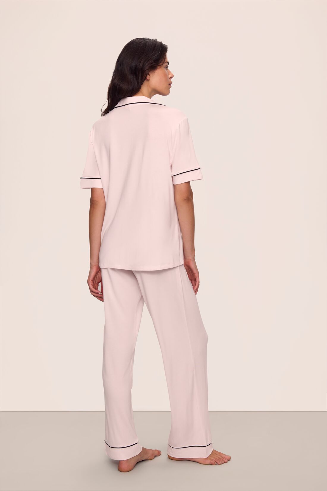 Model is wearing Gisele TENCEL™ Modal Short Sleeve & Pant PJ Set in Sorbet Pink/Black