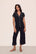 Model is wearing Gisele TENCEL™ Modal Short Sleeve Cropped PJ Set in Black/Sorbet Pink