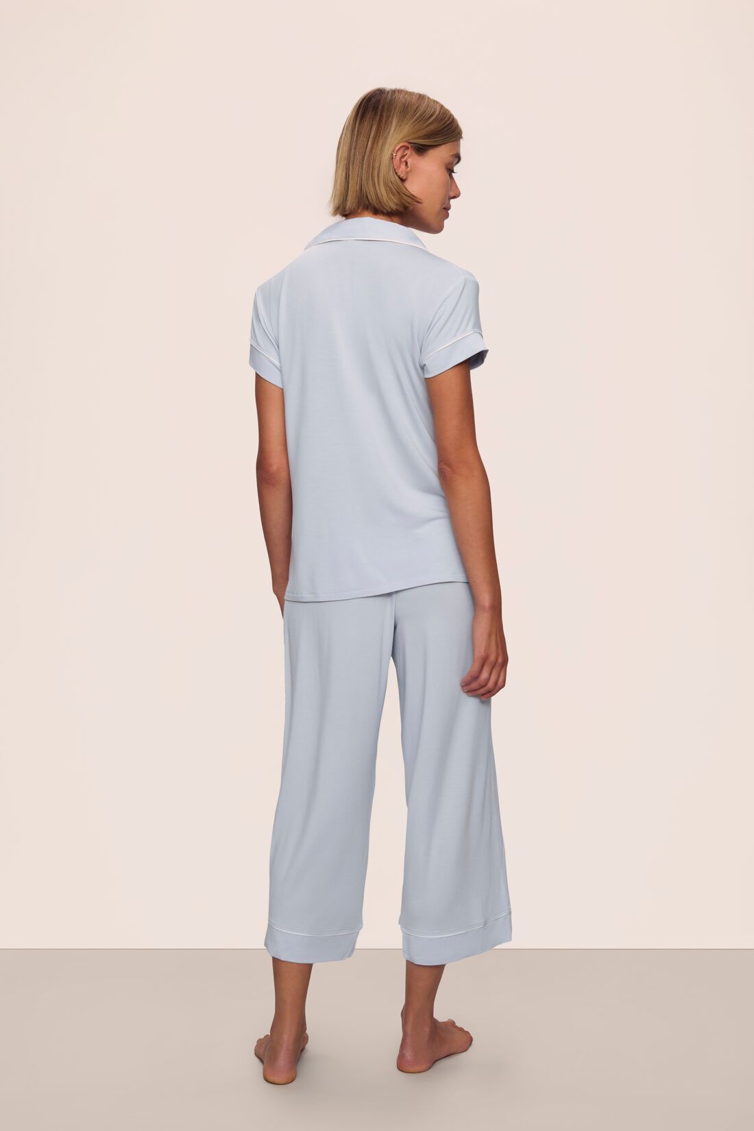 Model is wearing Gisele TENCEL™ Modal Cropped PJ Set in Ice Blue/Ivory