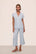 Model is wearing Gisele TENCEL™ Modal Cropped PJ Set in Ice Blue/Ivory