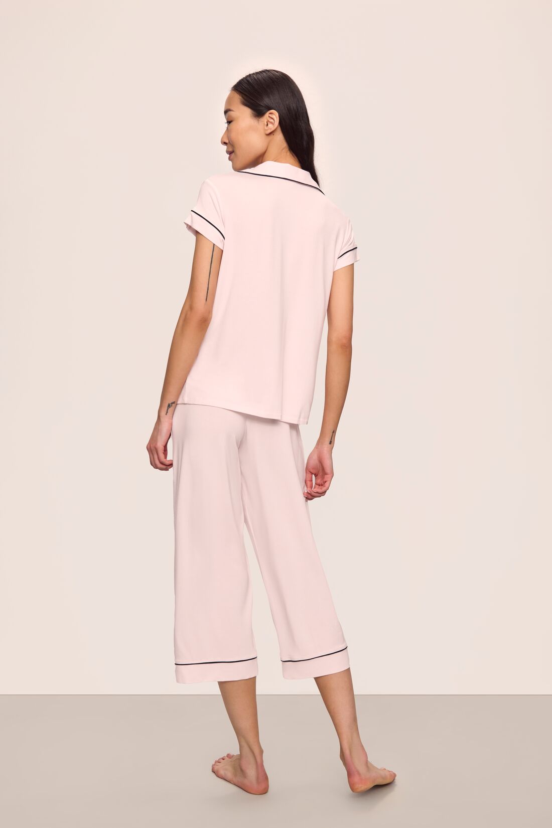 Model is wearing Gisele TENCEL™ Modal Short Sleeve Cropped PJ Set in Sorbet Pink/Black