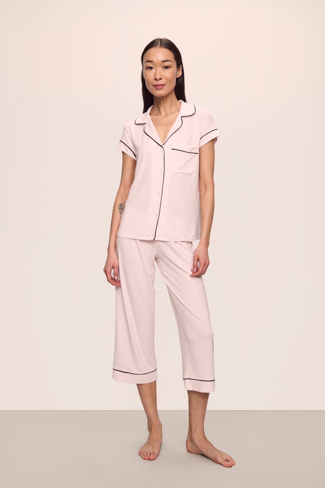Model is wearing Gisele TENCEL™ Modal Short Sleeve Cropped PJ Set in Sorbet Pink/Black