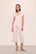 Model is wearing Gisele TENCEL™ Modal Short Sleeve Cropped PJ Set in Sorbet Pink/Black
