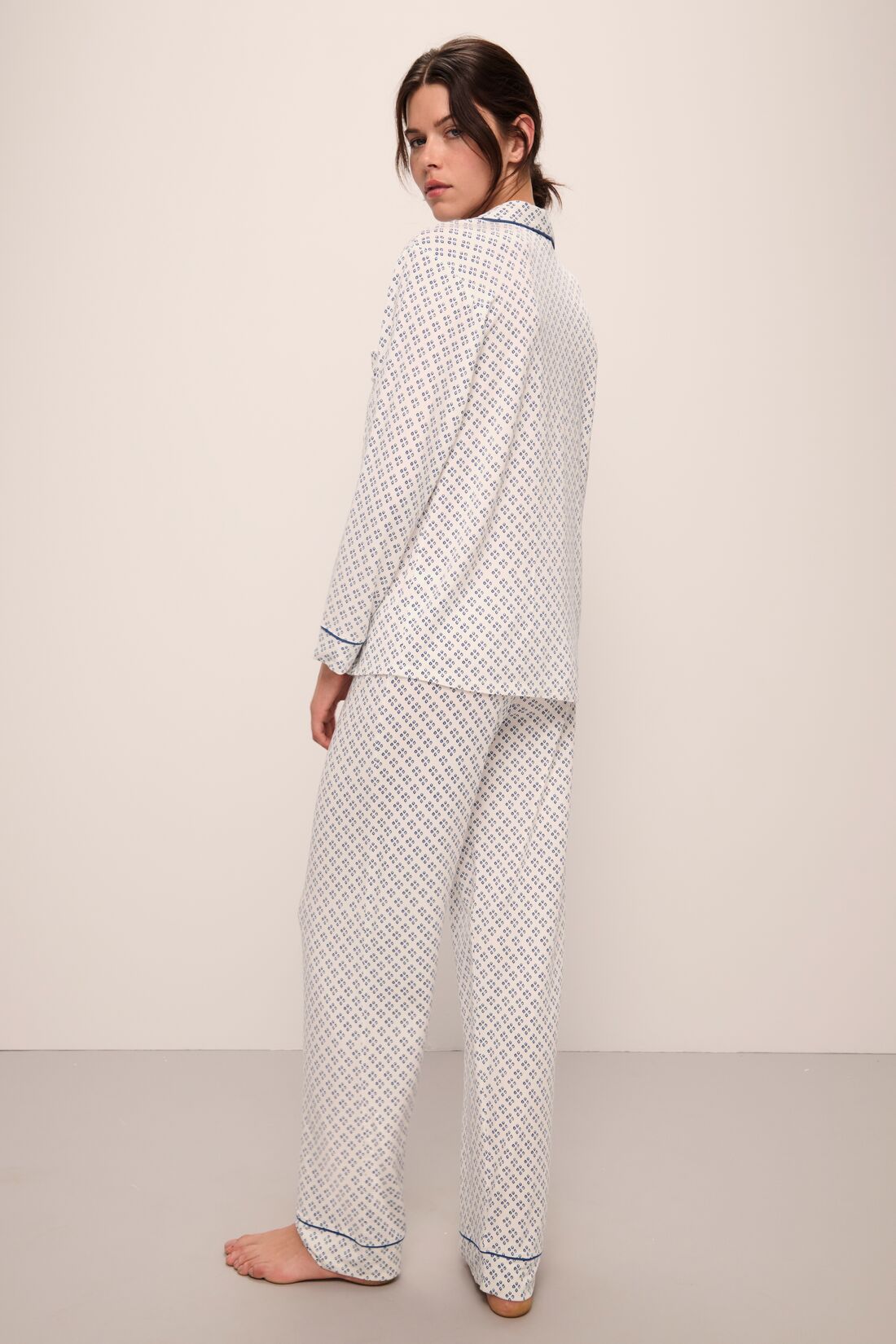 Model wears Gisele Printed TENCEL™ Modal Long PJ Set in Petite Batik Ivory/Denim Blue.