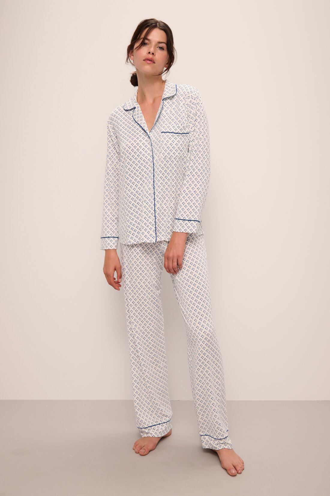 Model wears Gisele Printed TENCEL™ Modal Long PJ Set in Petite Batik Ivory/Denim Blue.