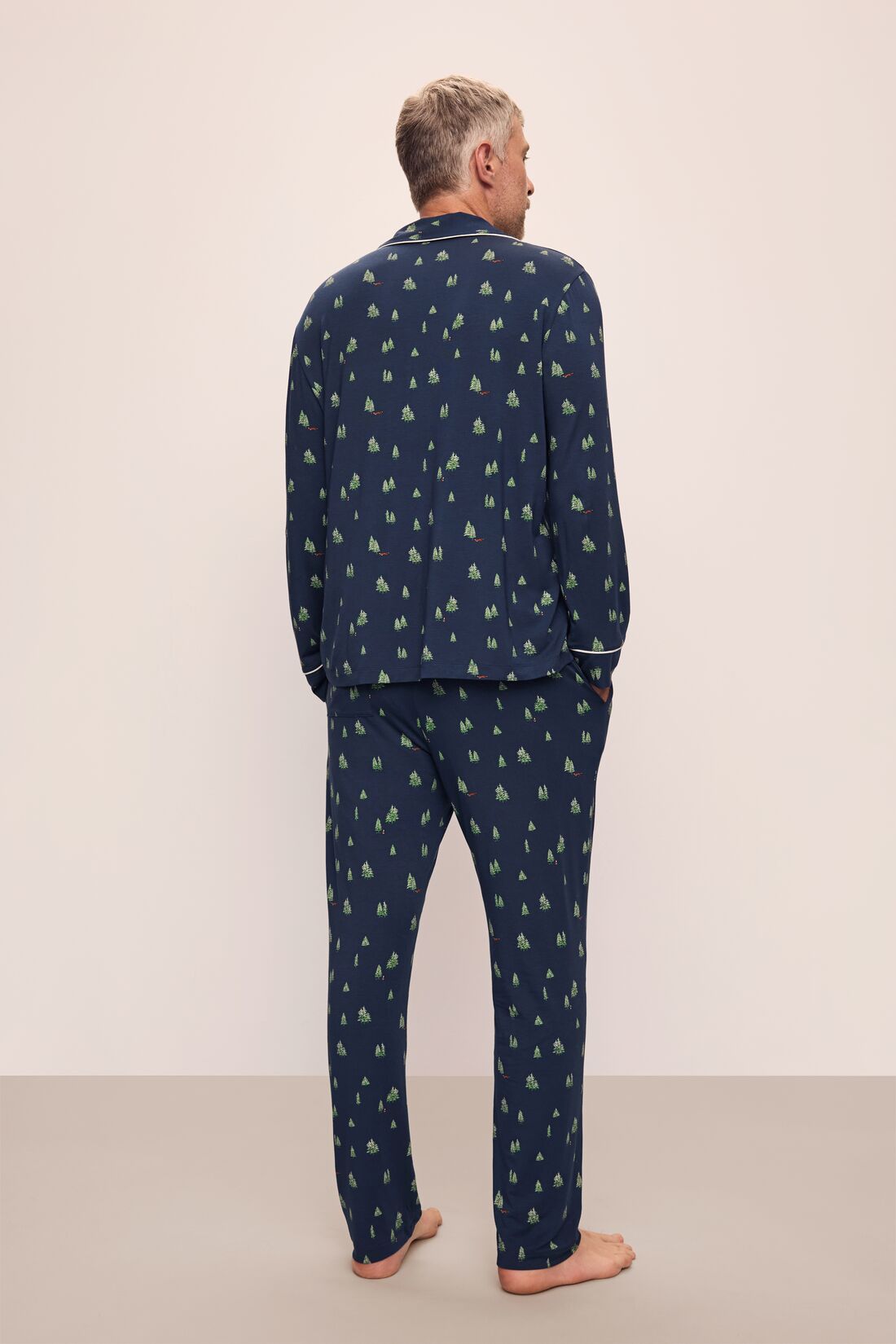Model wears William Printed TENCEL™ Modal Long PJ Set in Woodland Pine Navy/Ivory.