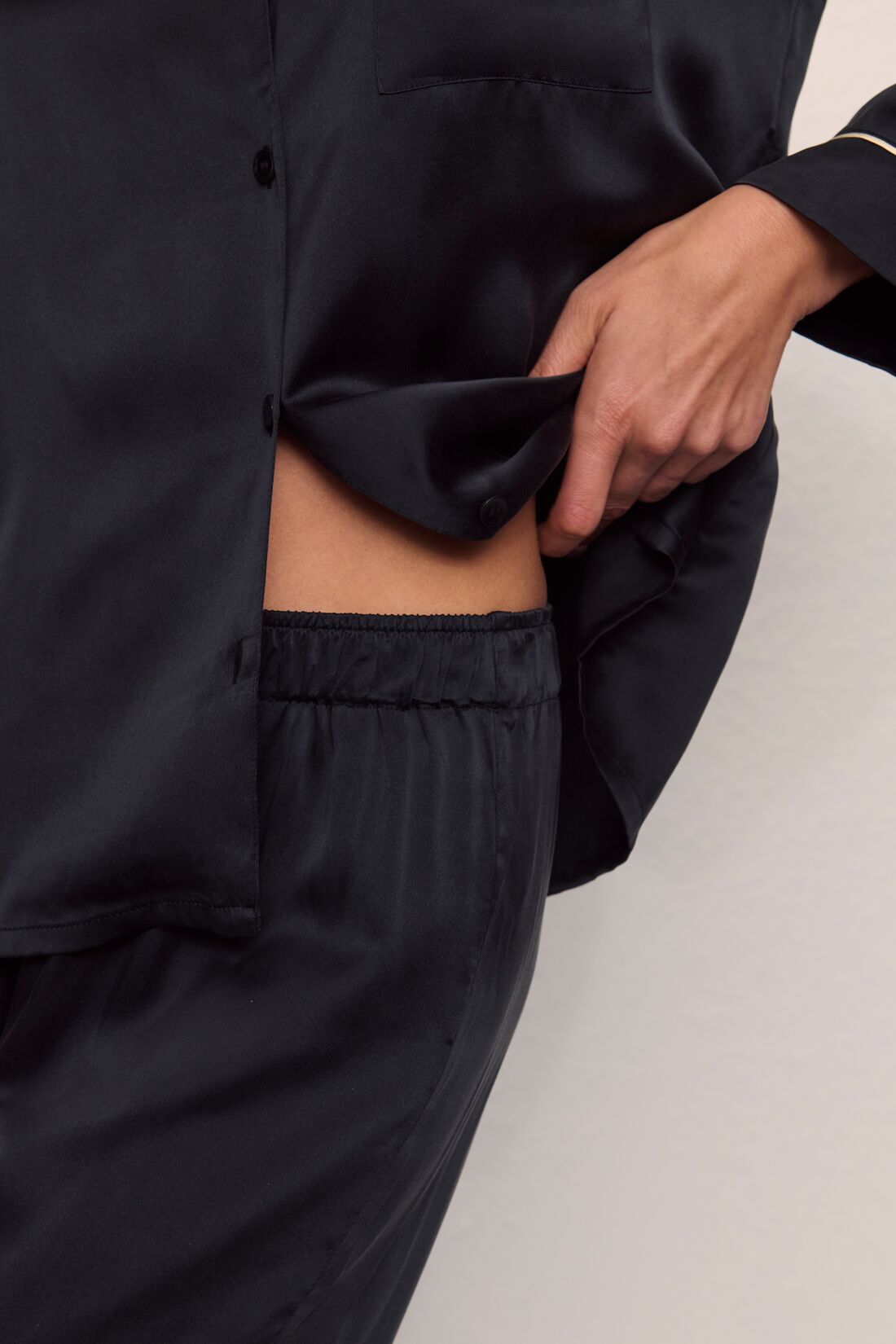 Model is wearing Inez Washable Silk Long PJ Set in Black/Champagne