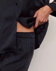 Model is wearing Inez Washable Silk Long PJ Set in Black/Champagne