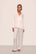 Model is wearing Inez Washable Silk Long PJ Set in Ivory/Champagne