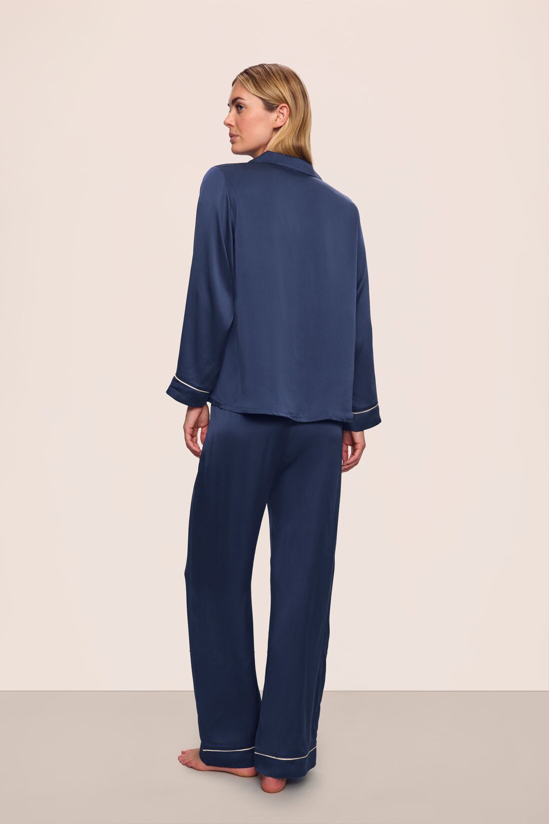 Model is wearing Inez Washable Silk Long PJ Set in Navy/Champagne