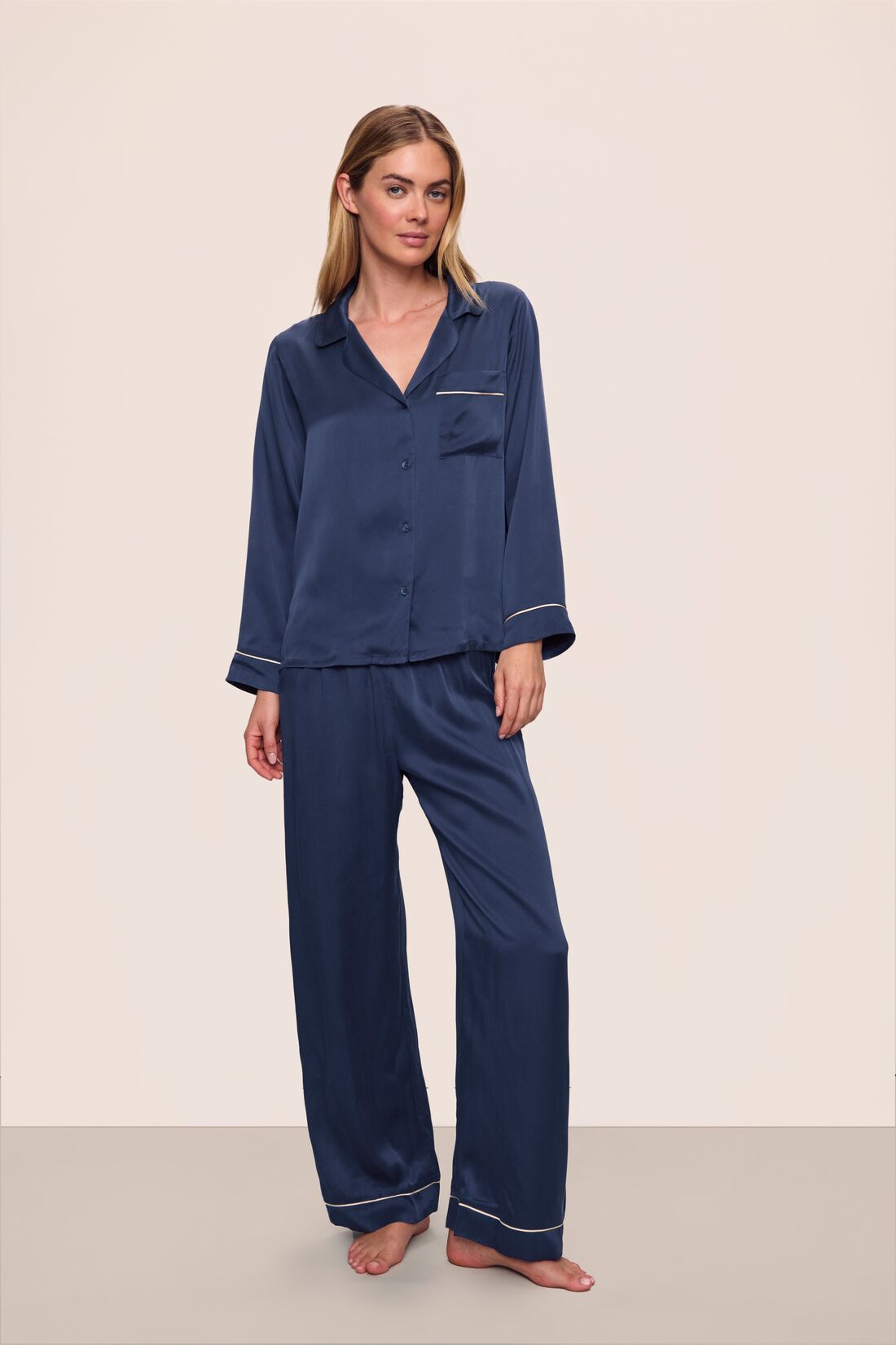Model is wearing Inez Washable Silk Long PJ Set in Navy/Champagne