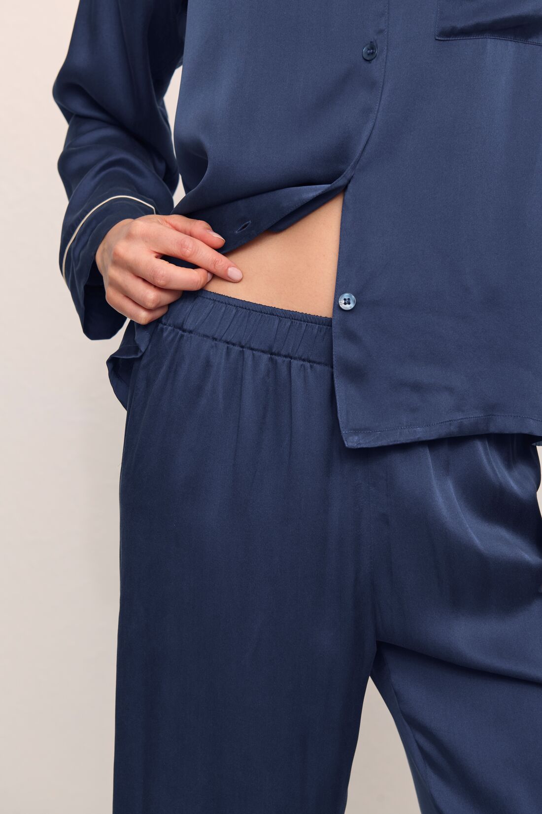 Model is wearing Inez Washable Silk Long PJ Set inNavy/Champagne