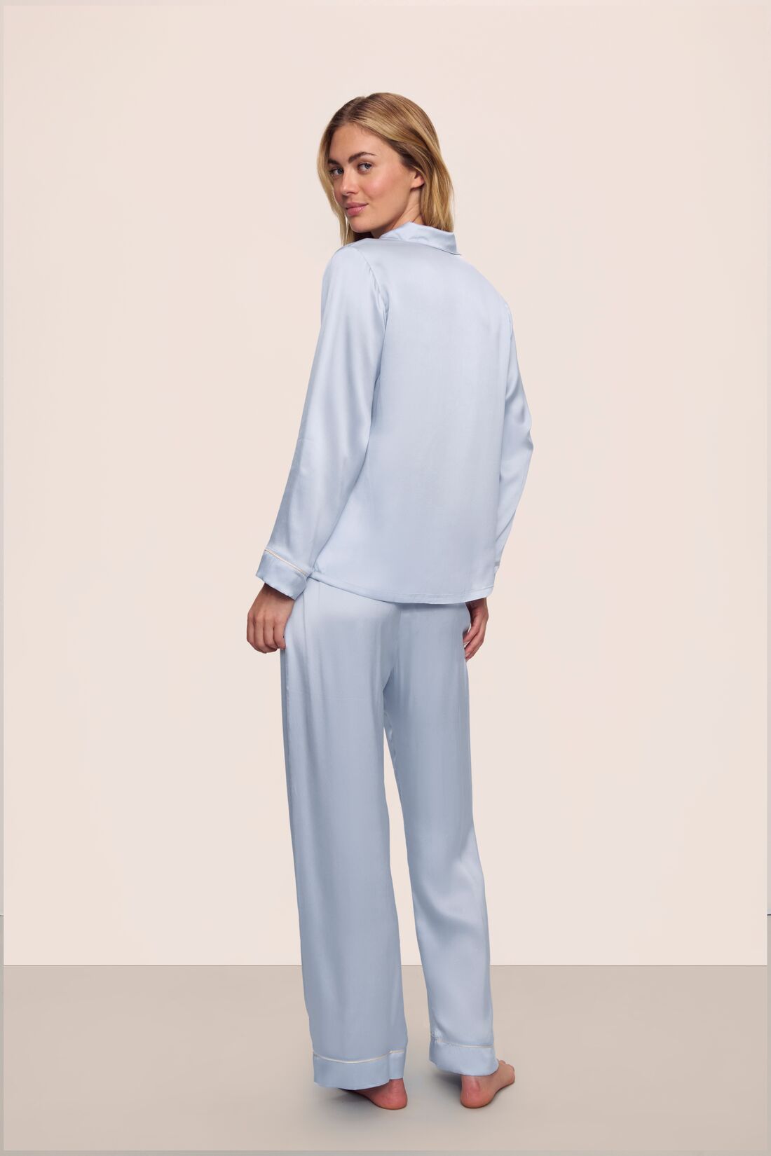 Model is wearing Inez Washable Silk Long PJ Set in Powder Blue/Champagne