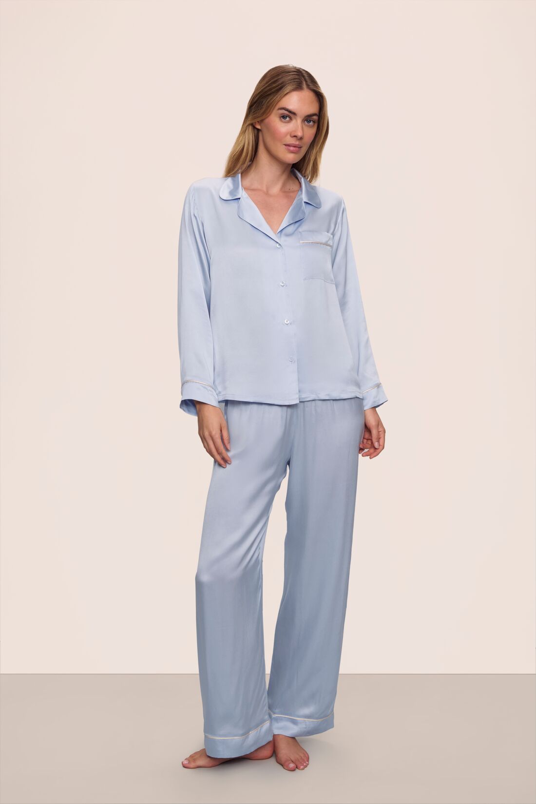 Model is wearing Inez Washable Silk Long PJ Set in Powder Blue/Champagne