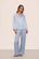 Model is wearing Inez Washable Silk Long PJ Set in Powder Blue/Champagne