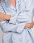 Model is wearing Inez Washable Silk Long PJ Set in Powder Blue/Champagne