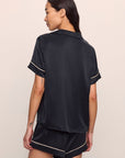 Model is wearing Inez Washable Silk Short PJ Set in Black/Champagne