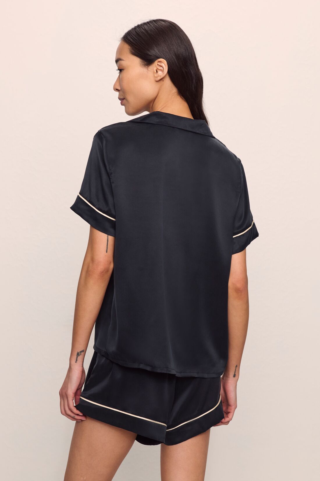 Model is wearing Inez Washable Silk Short PJ Set in Black/Champagne