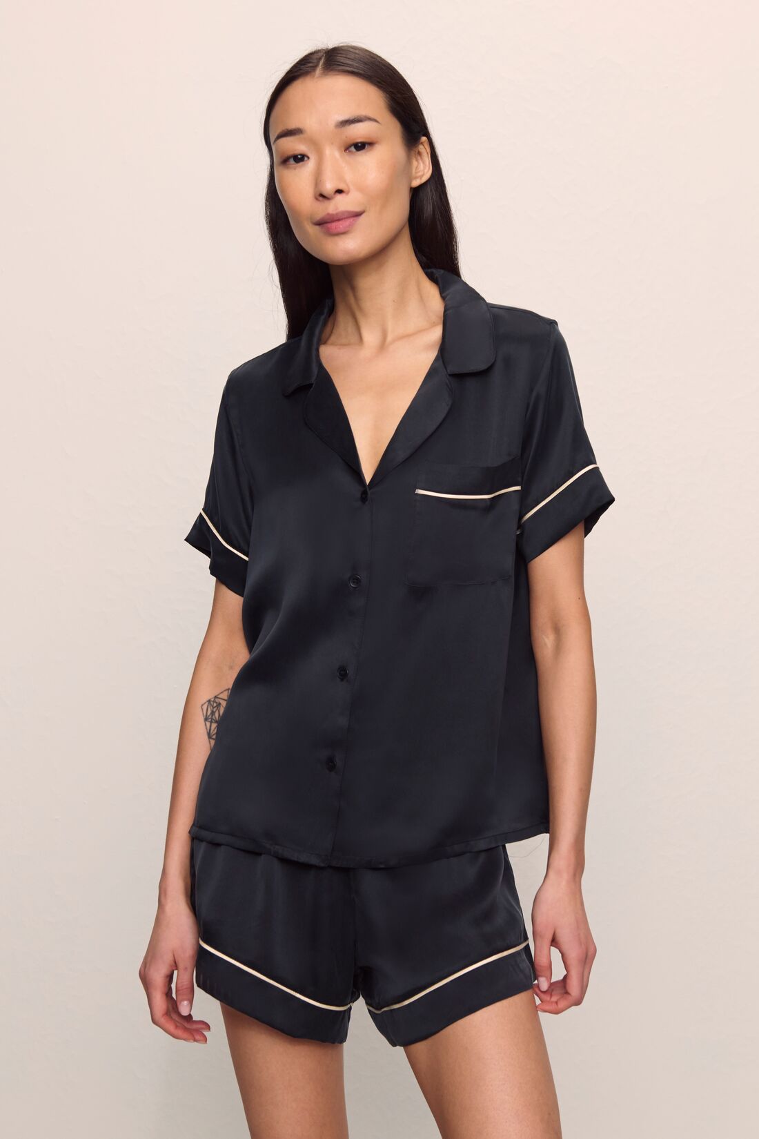 Model is wearing Inez Washable Silk Short PJ Set in Black/Champagne