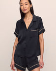 Model is wearing Inez Washable Silk Short PJ Set in Black/Champagne