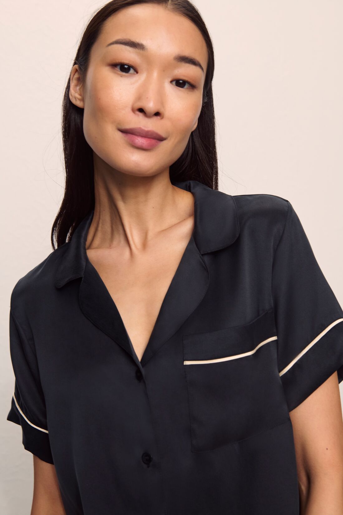 Model is wearing Inez Washable Silk Short PJ Set in Black/Champagne