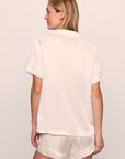 Model is wearing Inez Washable Silk Short PJ Set in Ivory/Champagne