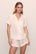 Model is wearing Inez Washable Silk Short PJ Set in Ivory/Champagne