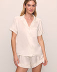 Model is wearing Inez Washable Silk Short PJ Set in Ivory/Champagne