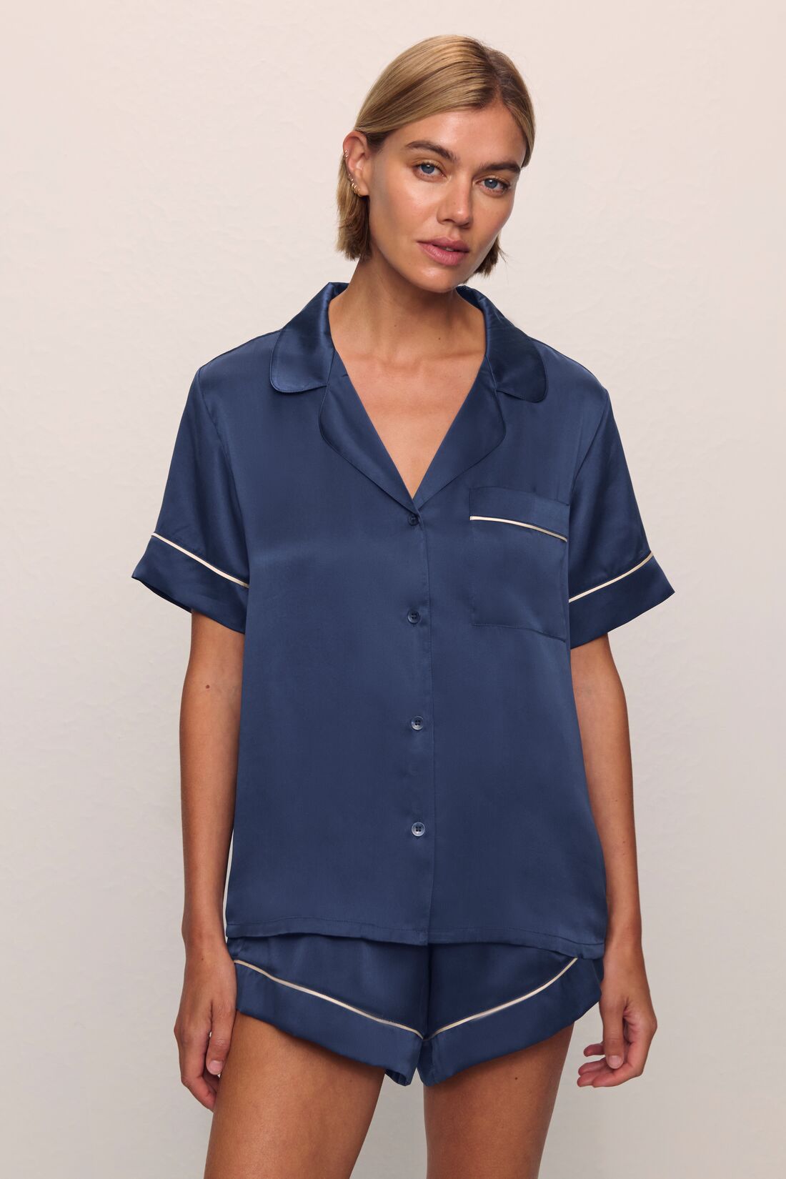Model is wearing Inez Washable Silk Short PJ Set in Rose Navy/Champagne