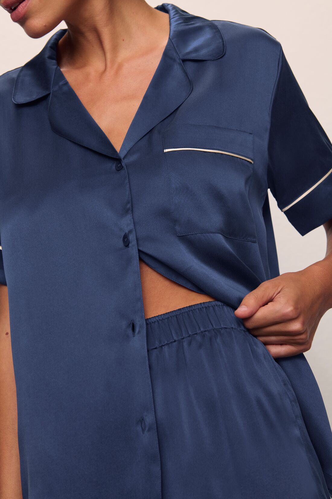Model is wearing Inez Washable Silk Short PJ Set in Rose Navy/Champagne