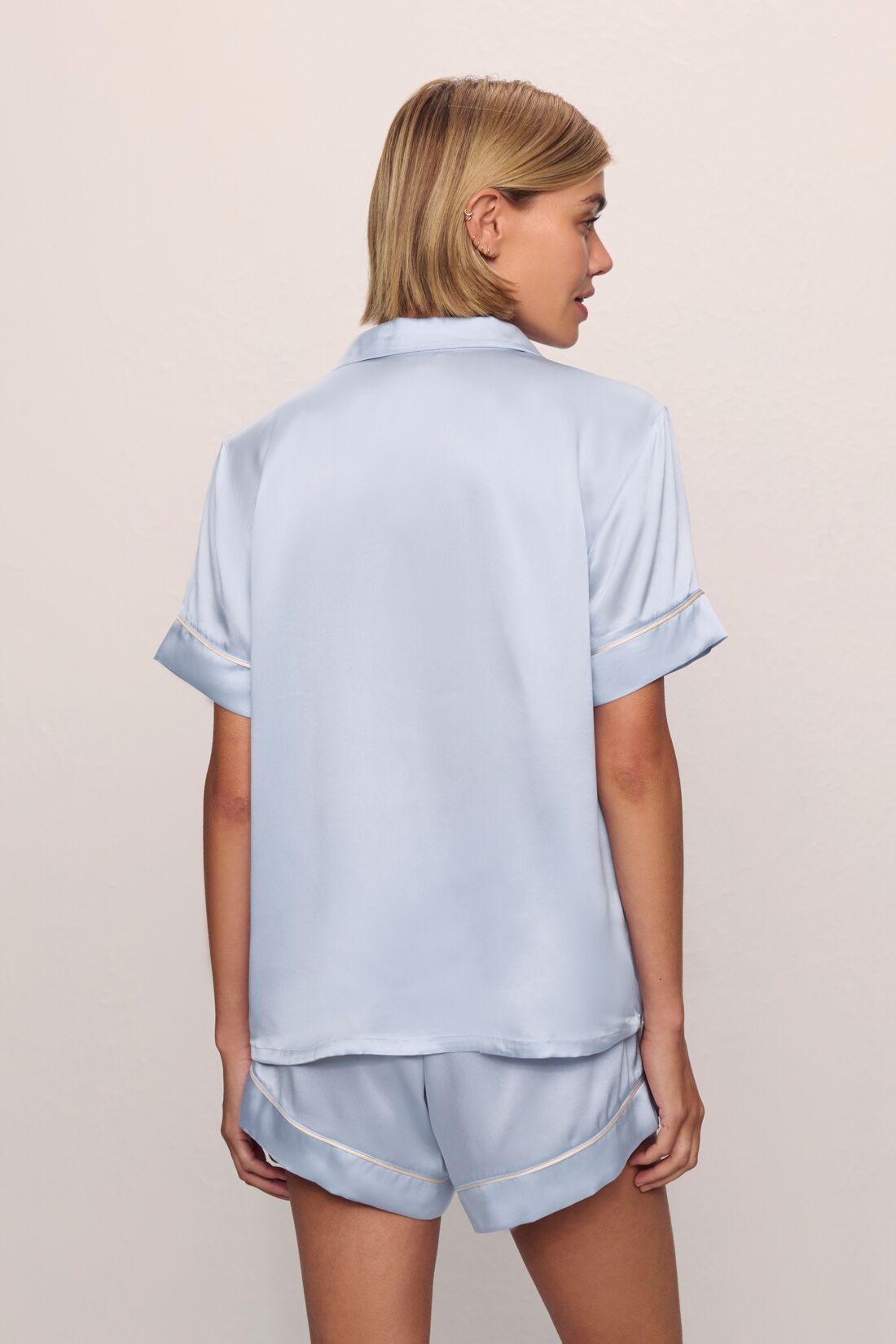 Model is wearing Inez Washable Silk Short PJ Set in Powder Blue/Champagne