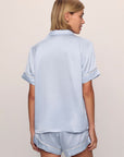 Model is wearing Inez Washable Silk Short PJ Set in Powder Blue/Champagne