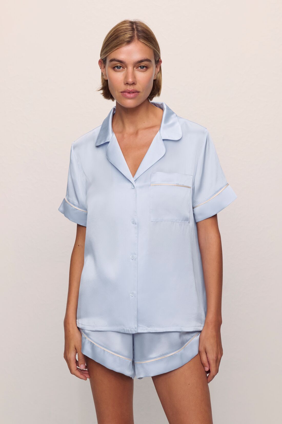 Model is wearing Inez Washable Silk Short PJ Set in Powder Blue/Champagne