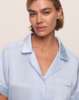 Model is wearing Inez Washable Silk Short PJ Set in Powder Blue/Champagne