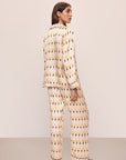 Model wears Inez Washable Silk Printed Long PJ Set in Leaves Boulder/Navy.