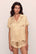 Model is wearing Inez Washable Silk Printed Short PJ Set in Mink Puff/Ivory