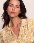 Model is wearing Inez Washable Silk Printed Short PJ Set in Mink Puff/Ivory
