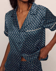 Model is wearing Inez Washable Silk Printed Short Set in Petite batik Navy/Ivory