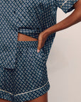 Model is wearing Inez Washable Silk Printed Short Set in Petite batik Navy/Ivory