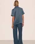 Model is wearing Inez Washable Silk Printed Short Sleeve Pant PJ Set in Petite Batik Navy/Ivory