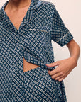 Model is wearing Inez Washable Silk Printed Short Sleeve Pant PJ Set in Petite Batik Navy/Ivory