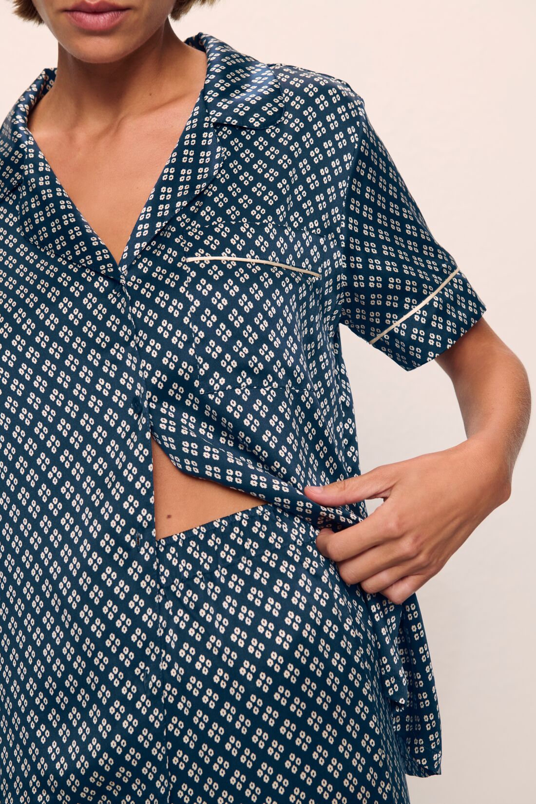 Model is wearing Inez Washable Silk Printed Short Sleeve Pant PJ Set in Petite Batik Navy/Ivory