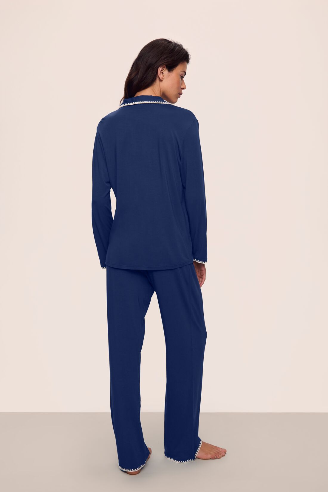 Model is wearing Frida TENCEL™ Modal Long PJ Set in Navy/Ivory
