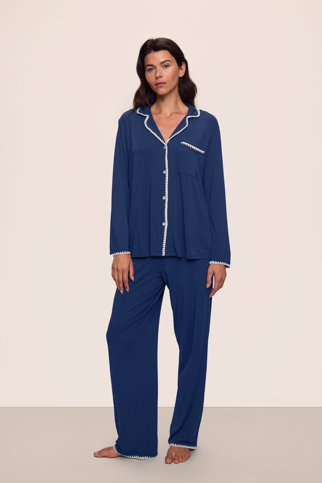 Model is wearing Frida TENCEL™ Modal Long PJ Set in Navy/Ivory
