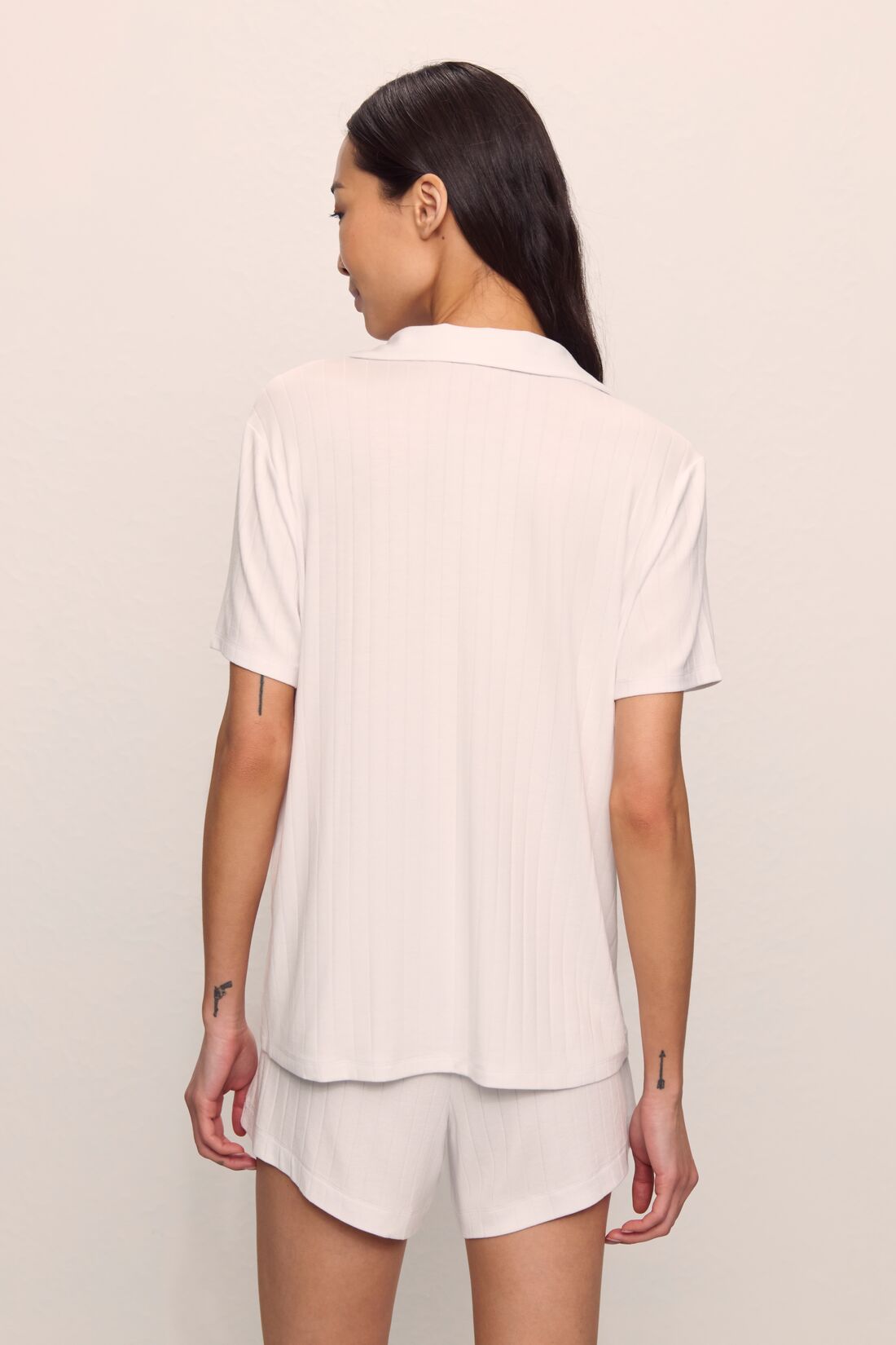 Model is wearing Gisele TENCEL™ Modal Rib Relaxed Short PJ Set in White