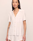 Model is wearing Gisele TENCEL™ Modal Rib Relaxed Short PJ Set in White