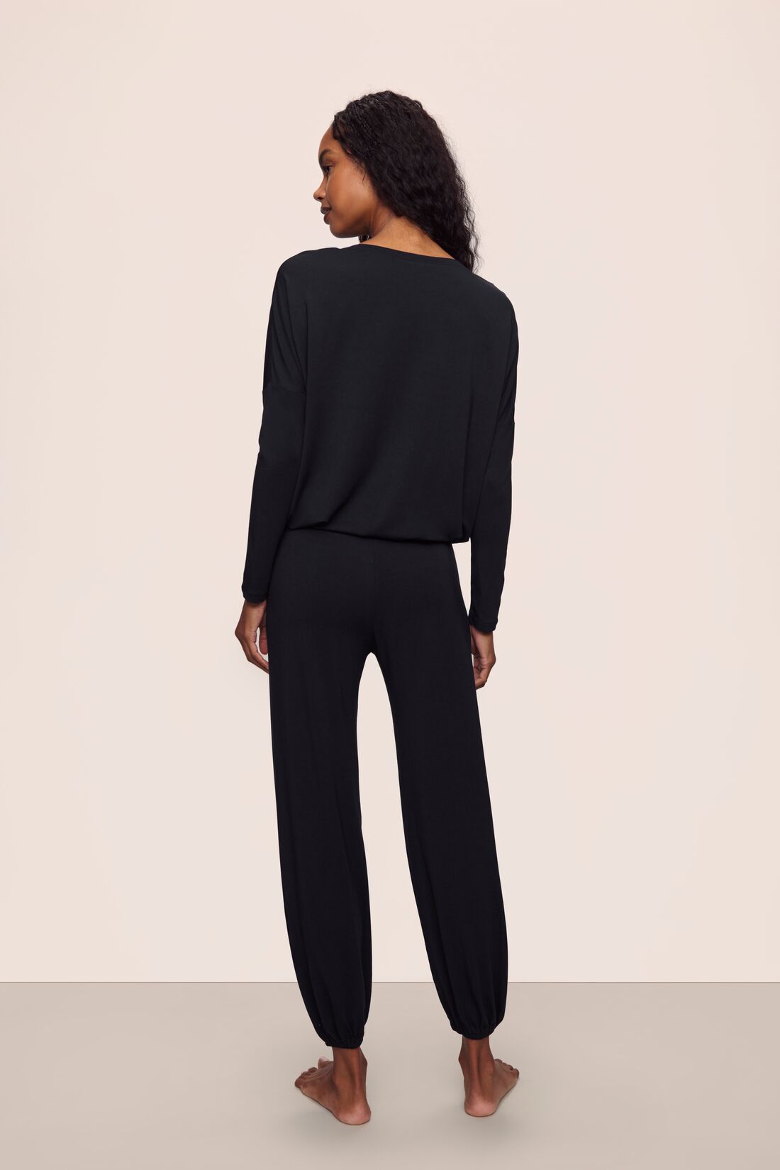Model is wearing Gisele TENCEL™ Modal Slouchy PJ Set in Black/Ivory